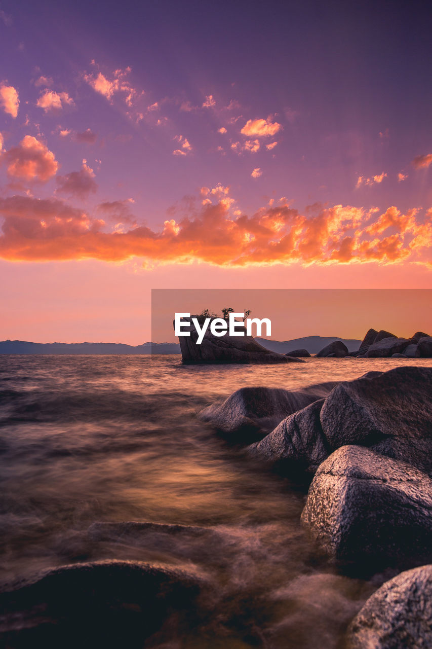 Scenic view of bonsai rock in lake tahoe, nevada during sunset