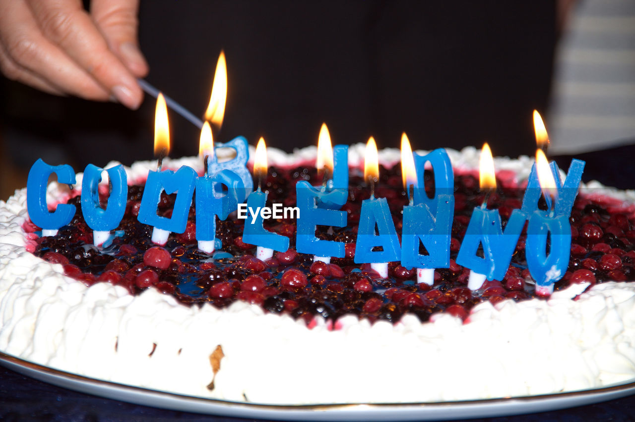 CLOSE-UP OF BIRTHDAY CAKE WITH CANDLES