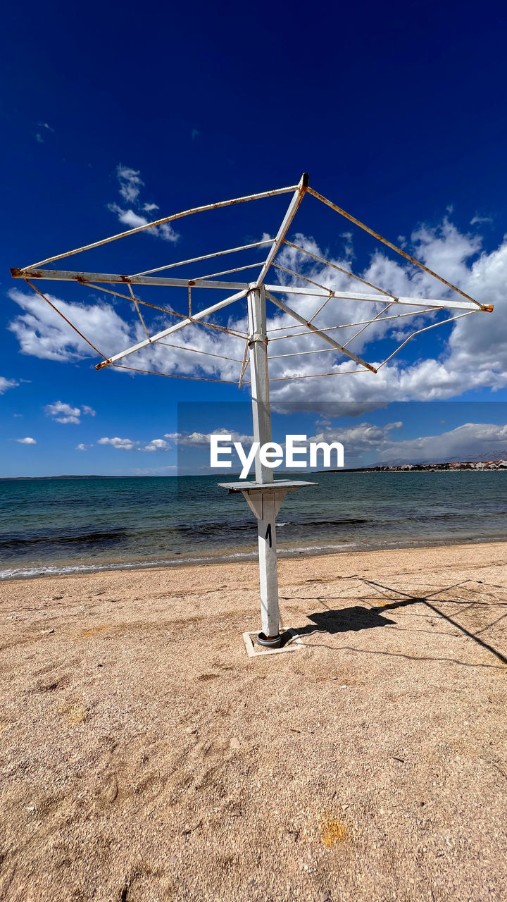 Uncovered parasol stand on vrsi -zukve beach, before the holiday season start, early in april 2022.