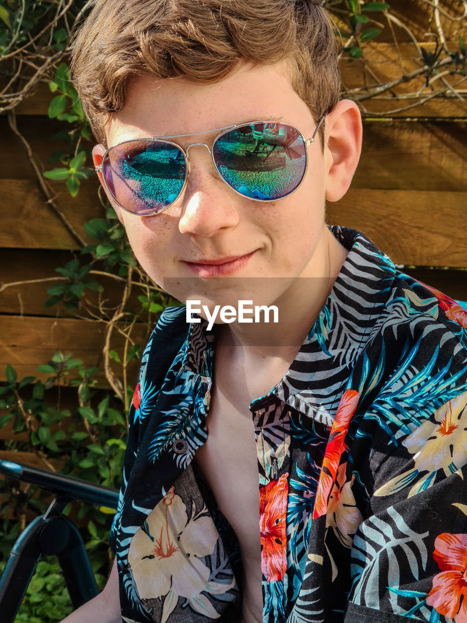 Portrait of smiling boy  wearing sunglasses