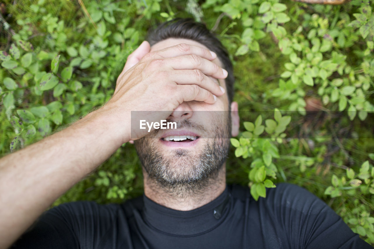 Tired runner in forest