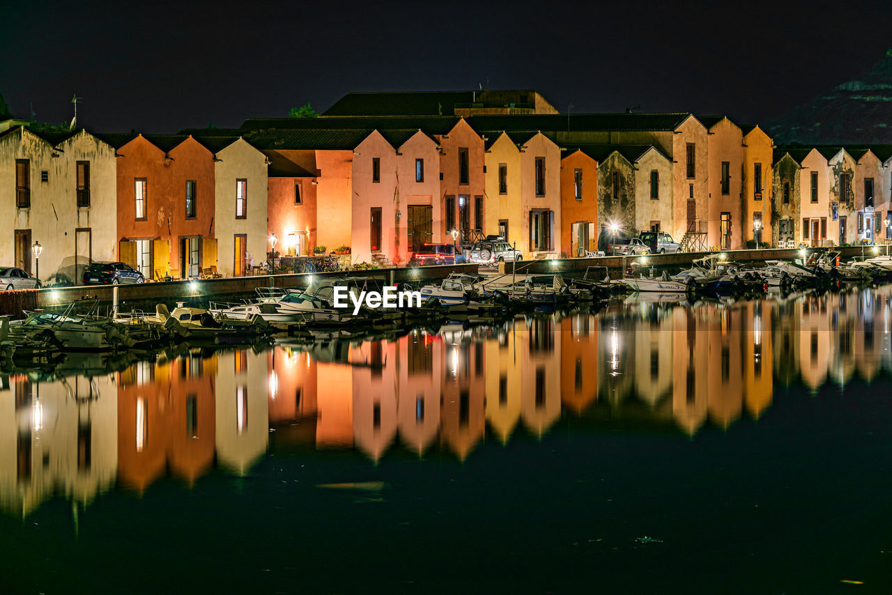 REFLECTION OF ILLUMINATED BUILDINGS IN RIVER