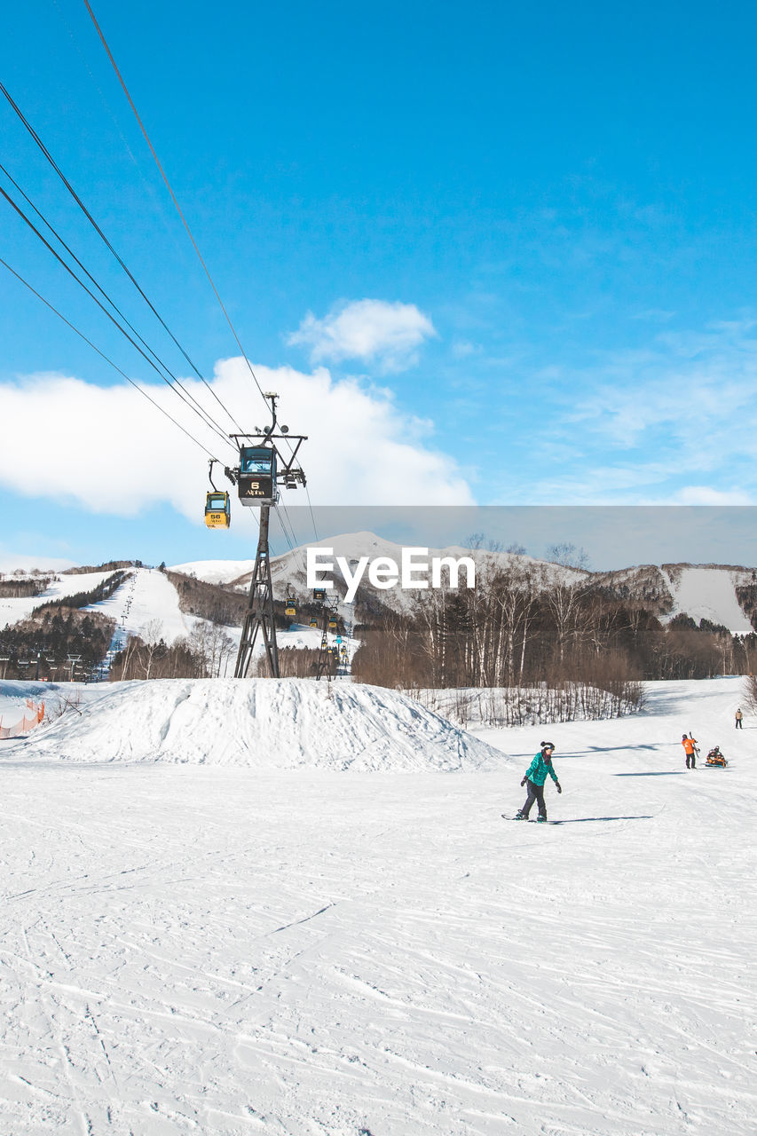 people on snow covered landscape