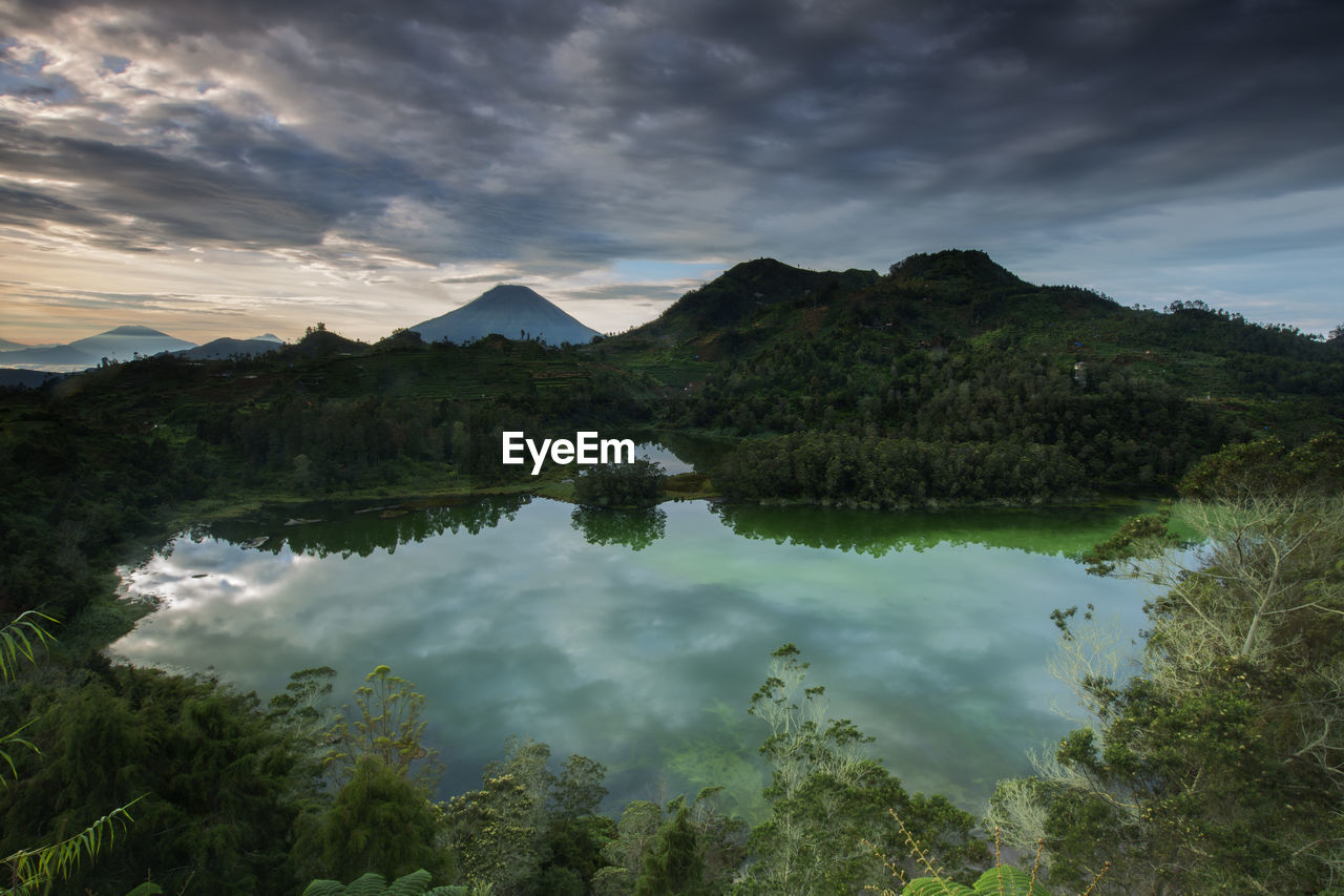 Scenic view of lake and mountains against sky