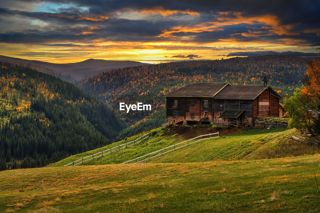 scenic view of landscape against sky during sunset