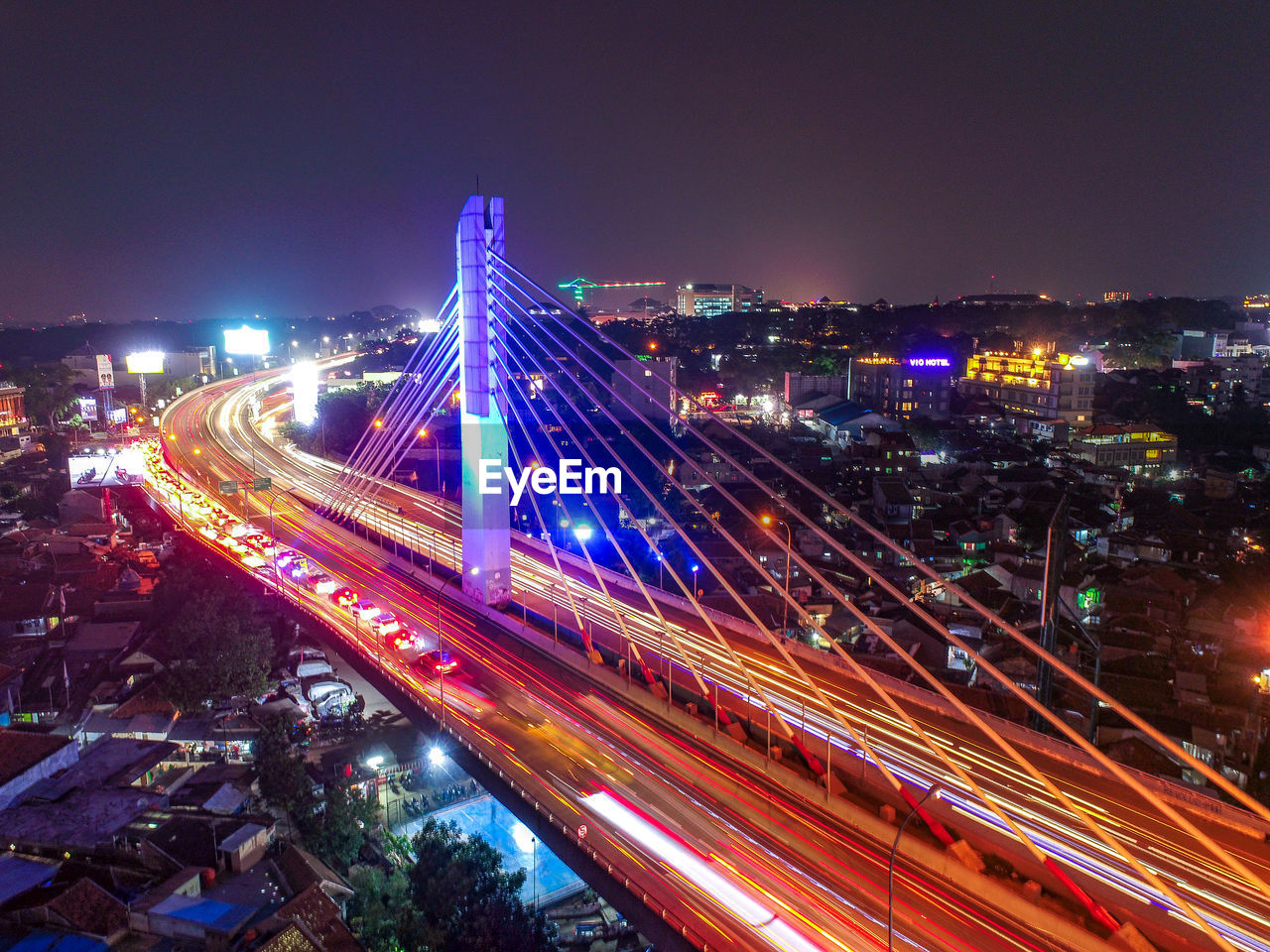 High angle view of light trails on road at night