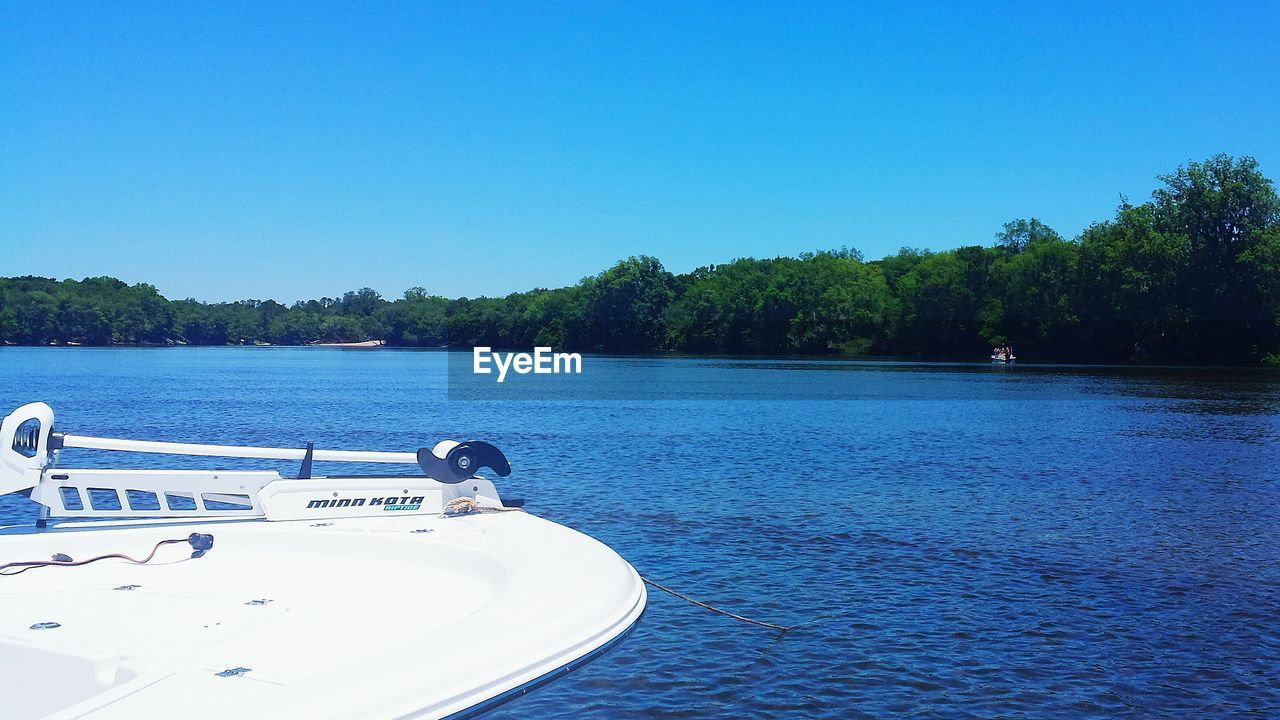 NAUTICAL VESSEL ON RIVER AGAINST CLEAR BLUE SKY