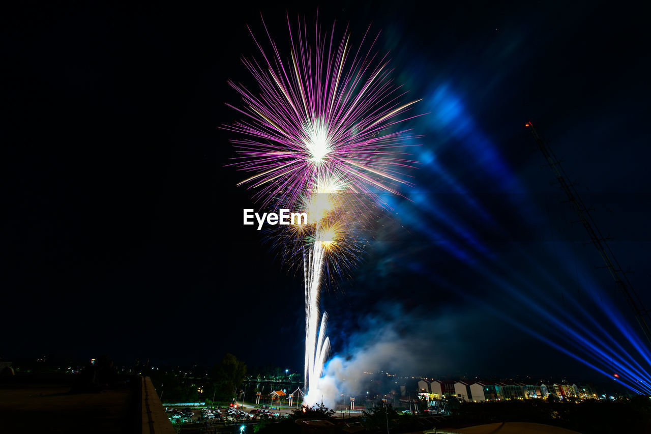 fireworks, event, arts culture and entertainment, night, illuminated, firework display, celebration, motion, exploding, recreation, architecture, firework - man made object, new year's eve, sky, nature, long exposure, city, building exterior, built structure, no people, outdoors, multi colored, glowing