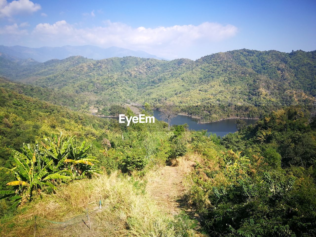 SCENIC VIEW OF LAND AND MOUNTAINS AGAINST SKY