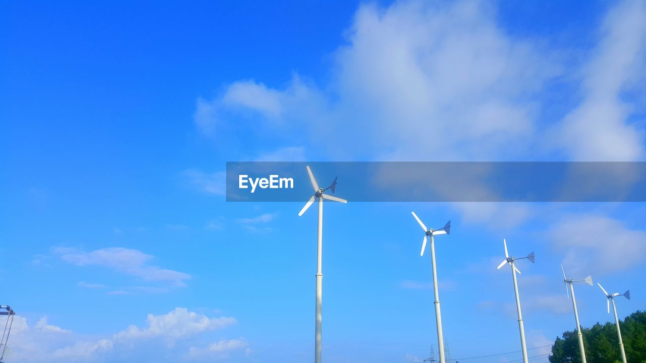 LOW ANGLE VIEW OF WIND TURBINE AGAINST SKY