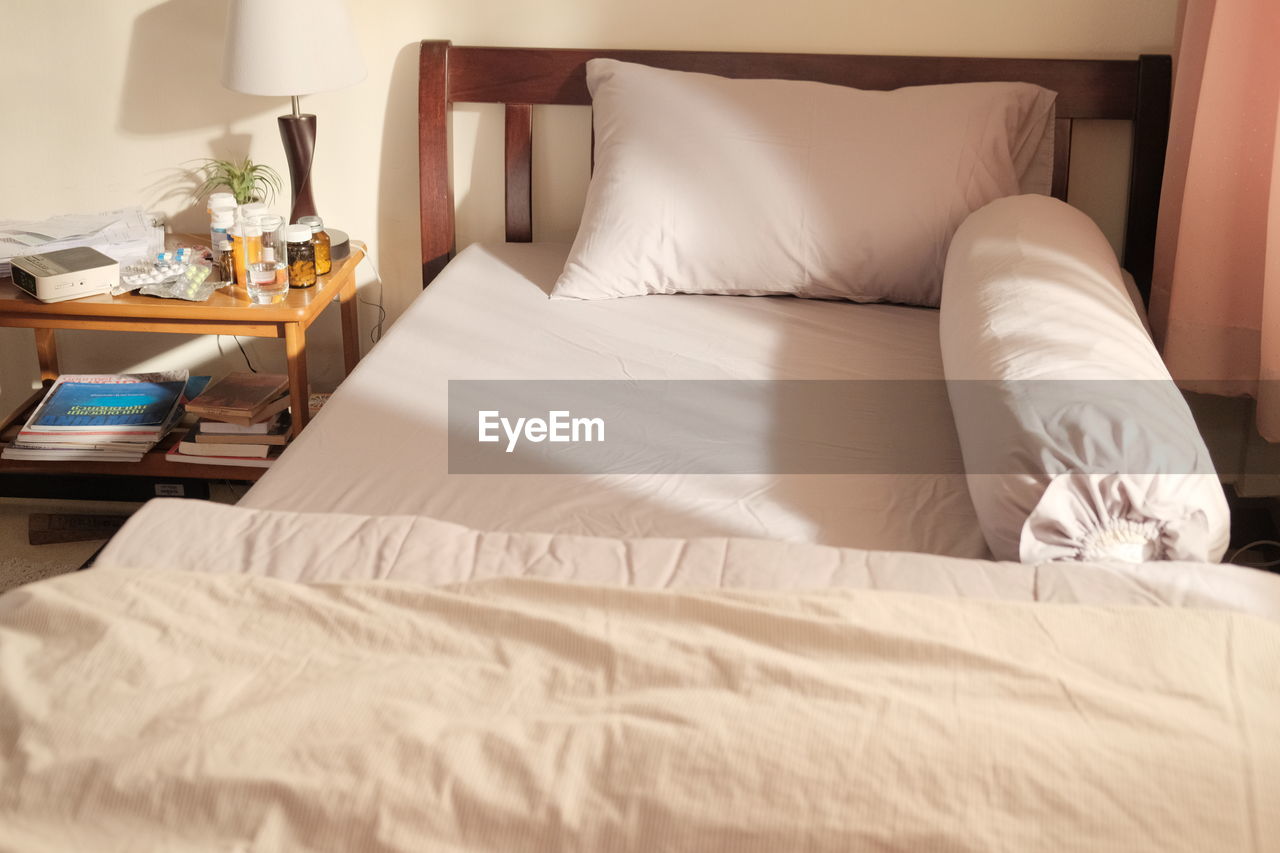 High angle view of empty bed at home