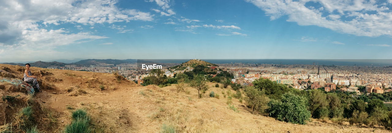 PANORAMIC VIEW OF LANDSCAPE AGAINST SKY IN CITY