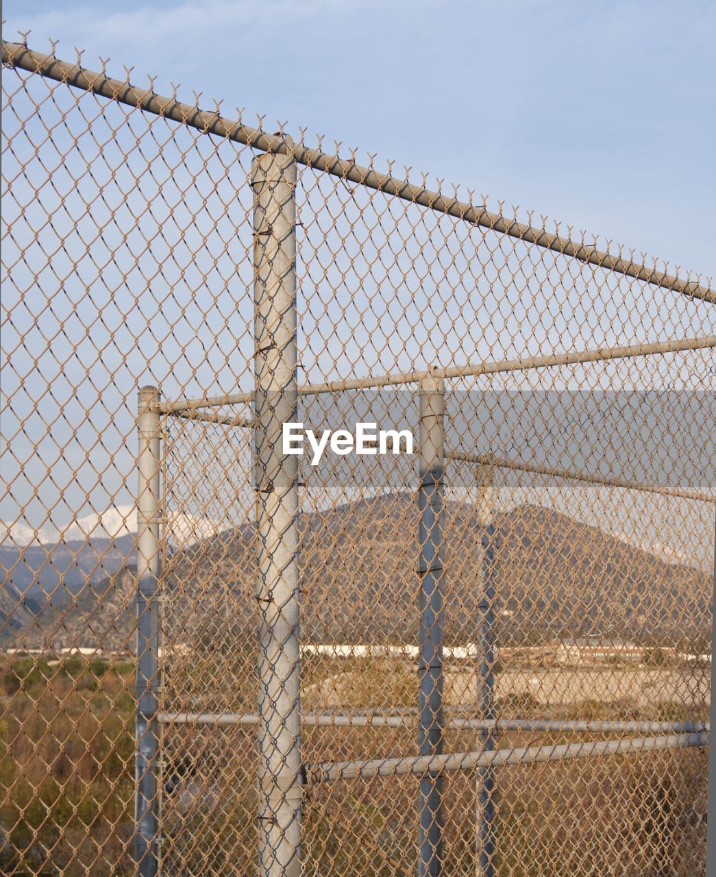Chainlink fence against sky