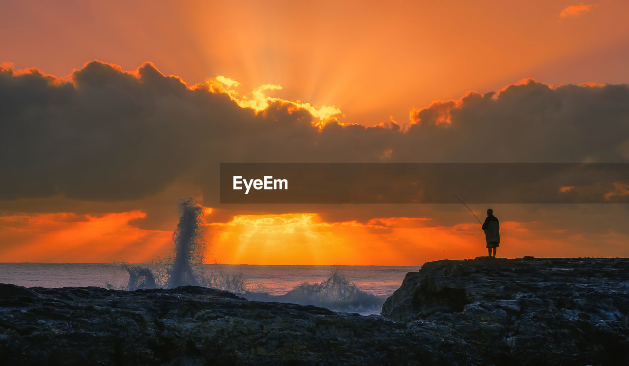 Scenic view of sea against sky during sunrise 