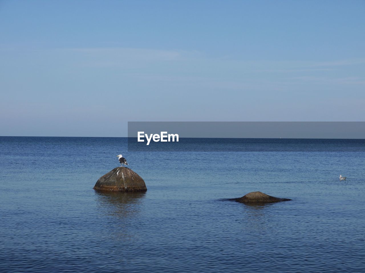 water, sea, sky, horizon over water, horizon, ocean, scenics - nature, beauty in nature, shore, tranquility, tranquil scene, nature, body of water, coast, no people, blue, bay, idyllic, reflection, day, land, islet, waterfront, tower, beach, outdoors, non-urban scene, nautical vessel, clear sky, wave, vehicle