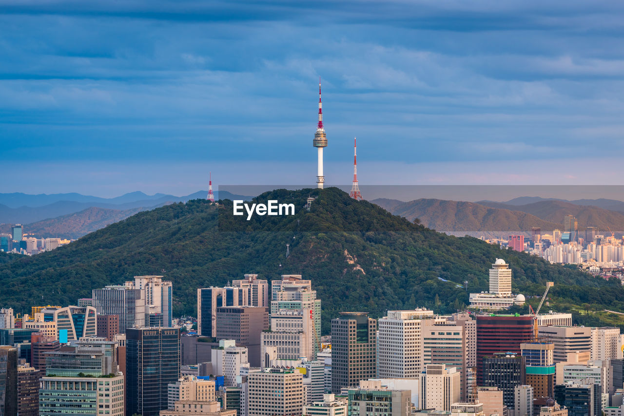 View of city against cloudy sky