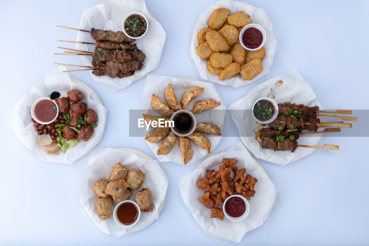 food and drink, food, high angle view, healthy eating, meal, no people, indoors, freshness, studio shot, variation, nut, wellbeing, plate, nut - food, breakfast, table, fruit, dish, produce, snack, directly above, still life, bowl, large group of objects