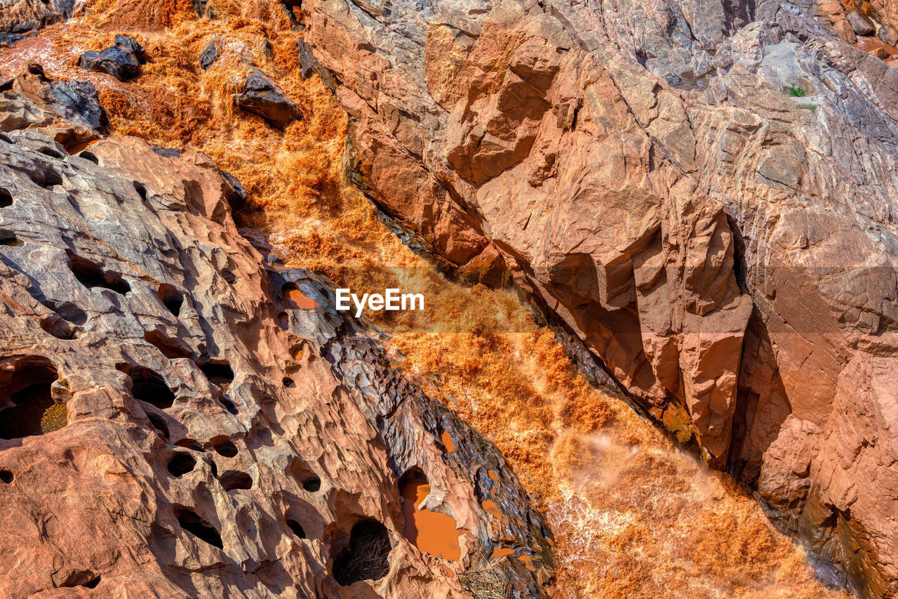 FULL FRAME SHOT OF ROCK FORMATIONS ON LAND