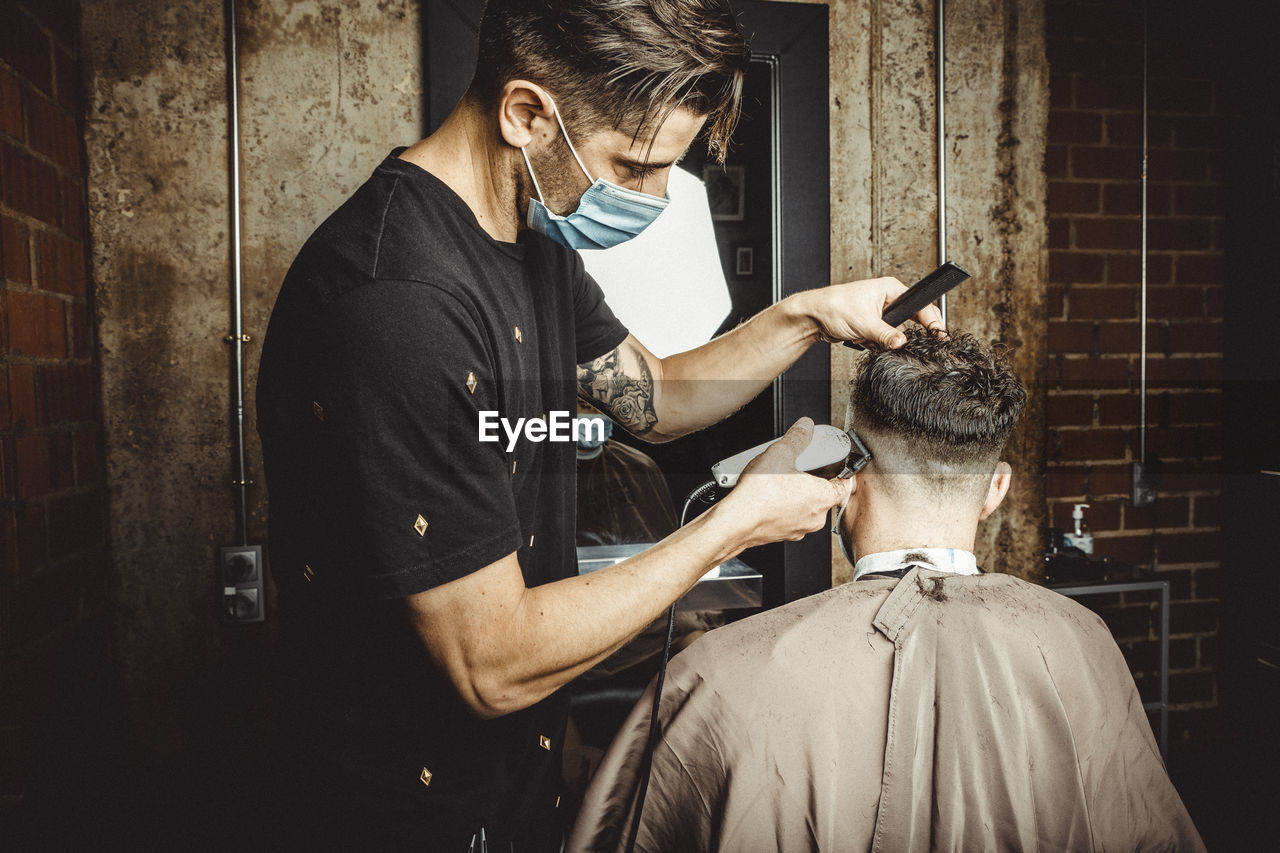 Beautician and hairdresser working with mask for the covid19 virus