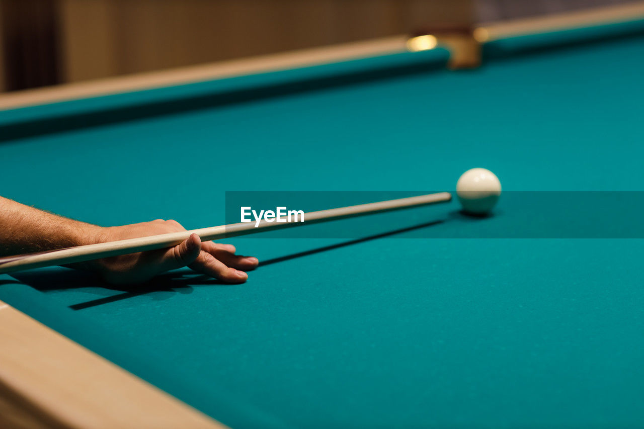 high angle view of woman playing pool