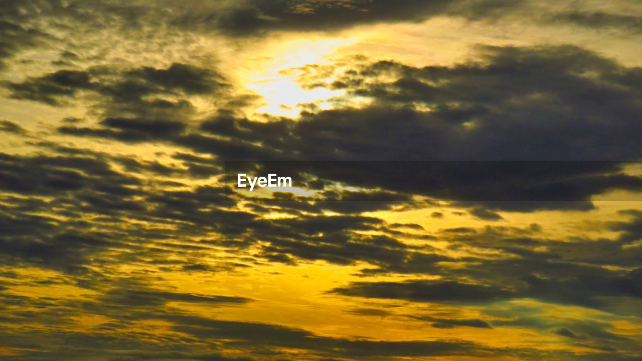 LOW ANGLE VIEW OF ORANGE CLOUDS IN SKY