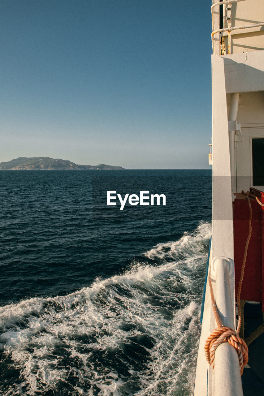 Sea view with island on the horizont from the ferry boat, travel and transportation.