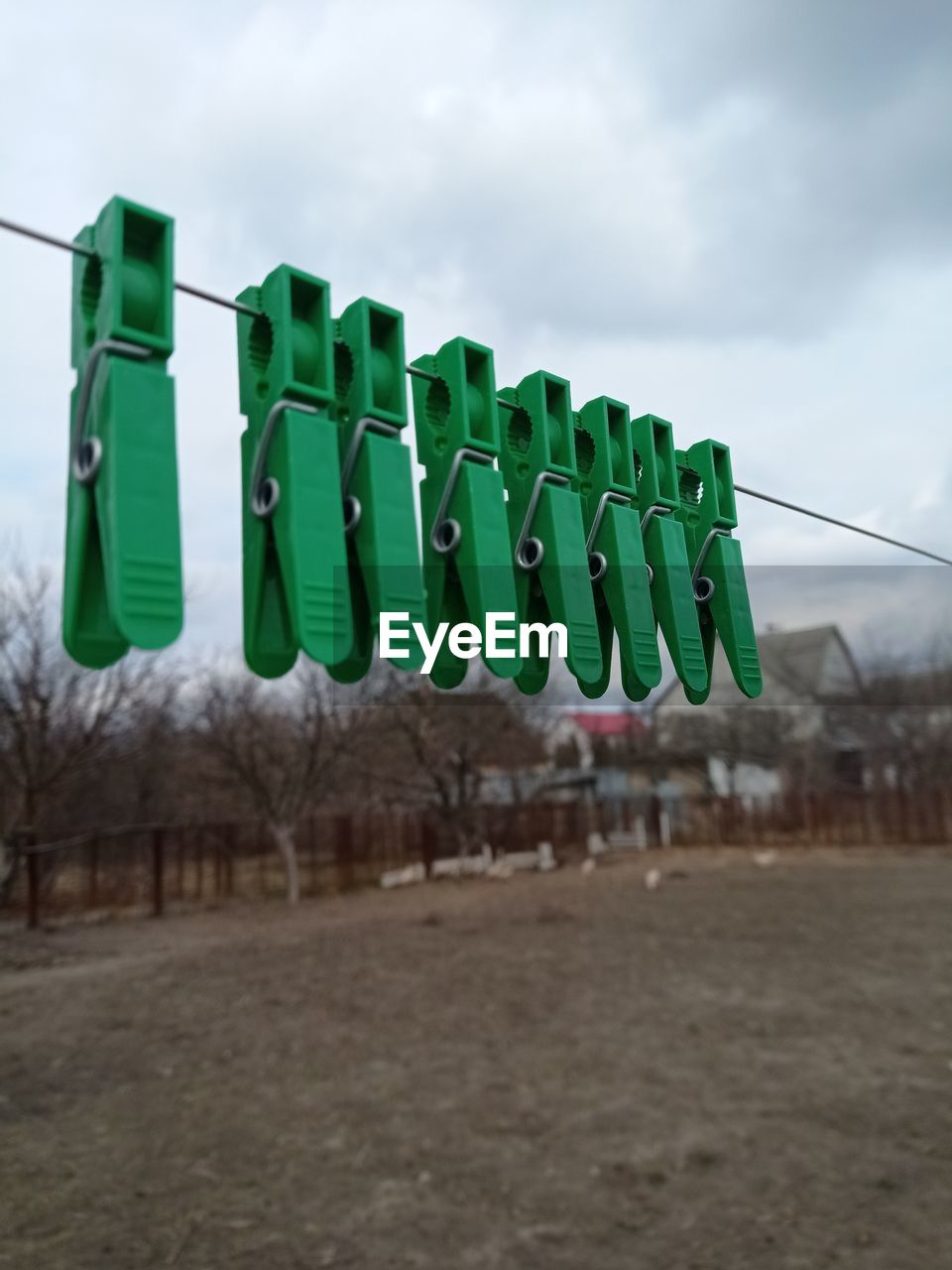 low angle view of empty chairs on field against sky