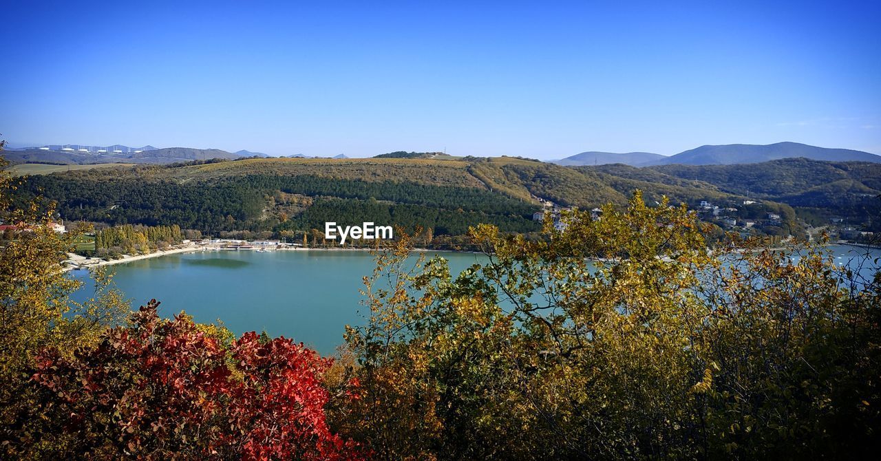 SCENIC VIEW OF LAKE AGAINST BLUE SKY