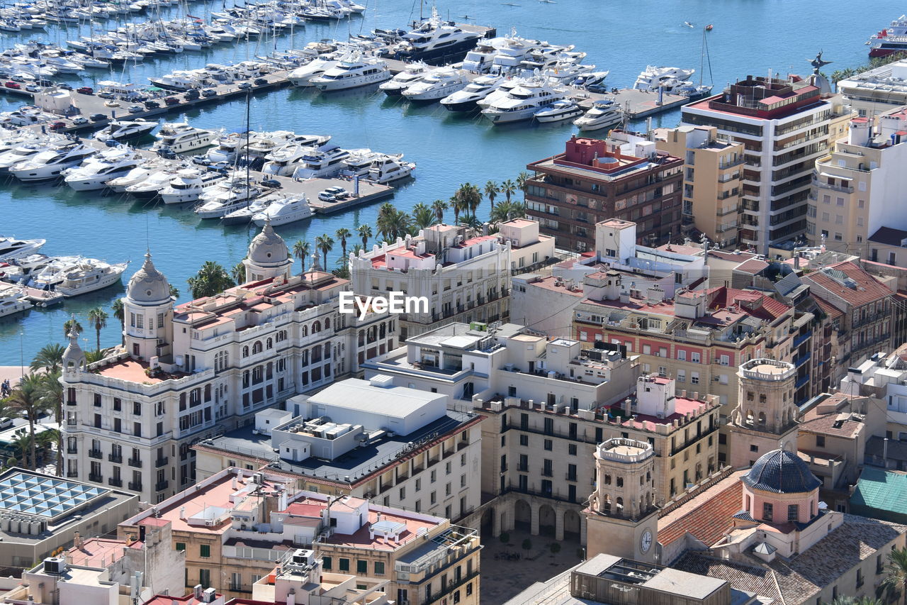 HIGH ANGLE VIEW OF CITY BY SEA