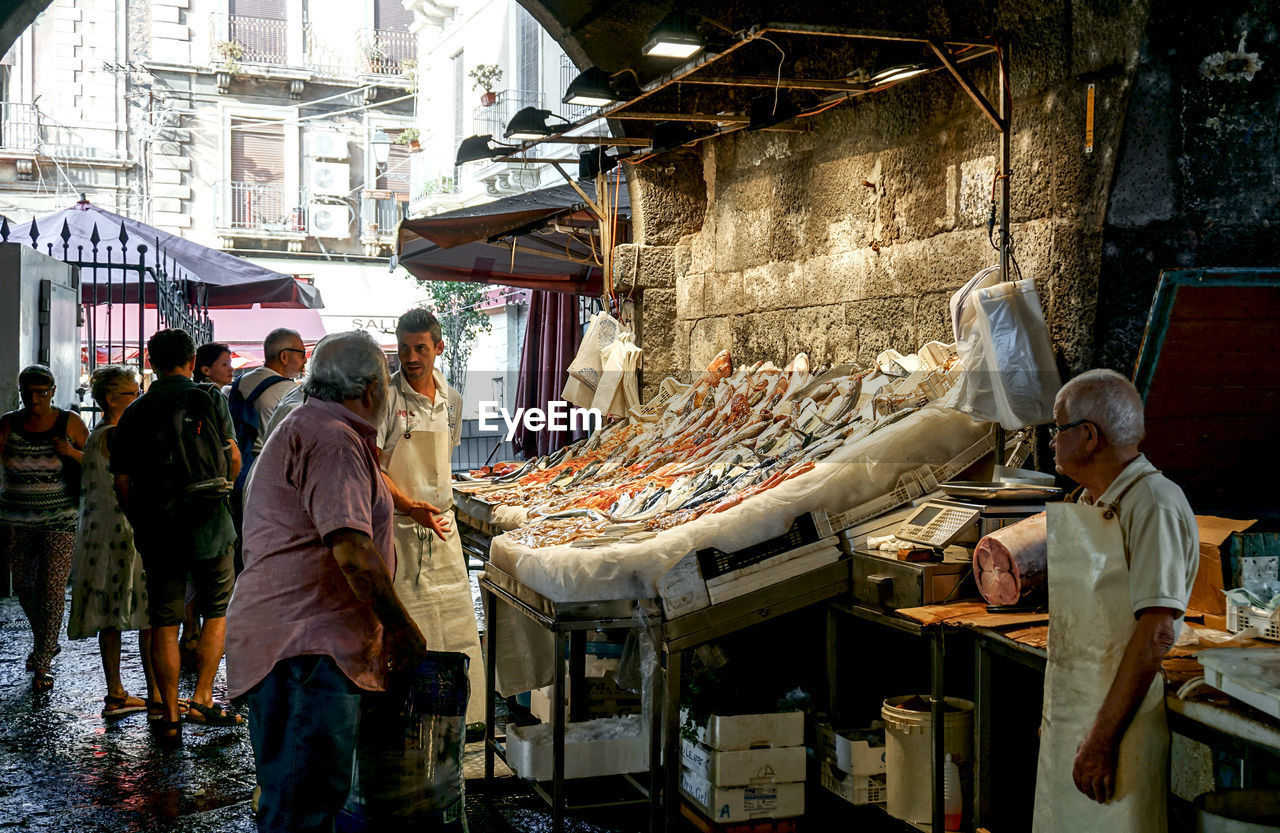 GROUP OF PEOPLE IN MARKET