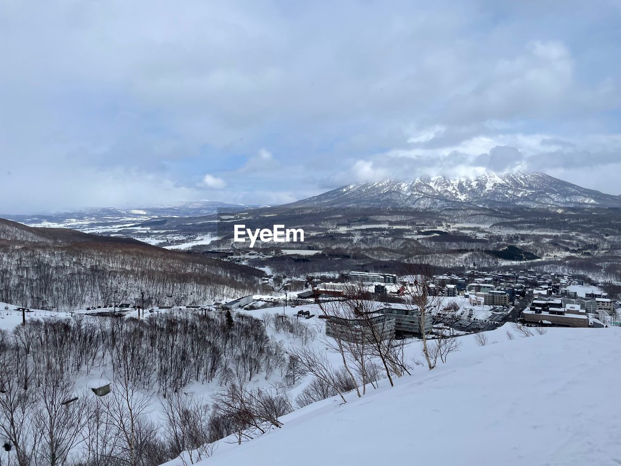 snow, cold temperature, winter, environment, scenics - nature, landscape, mountain, beauty in nature, cloud, sky, nature, mountain range, snowcapped mountain, tranquil scene, tranquility, land, no people, non-urban scene, travel destinations, travel, frozen, tree, tourism, plant, water, piste, day, outdoors, pinaceae, polar climate, forest, white, ice, coniferous tree, ridge, idyllic, pine tree, pine woodland, architecture, overcast, remote, deep snow