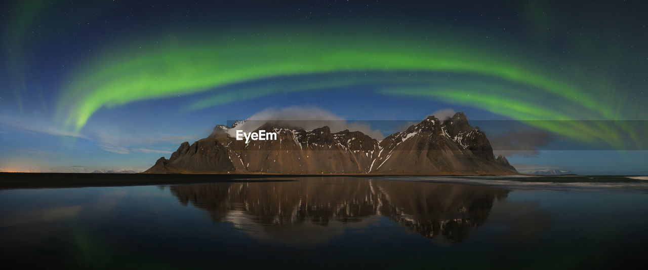 SCENIC VIEW OF LAKE AGAINST SKY AT NIGHT