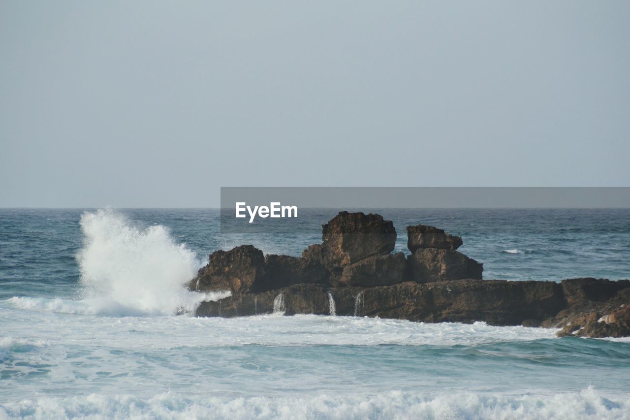 Scenic view of sea against clear sky