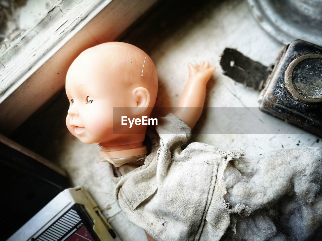 High angle view of broken doll on table