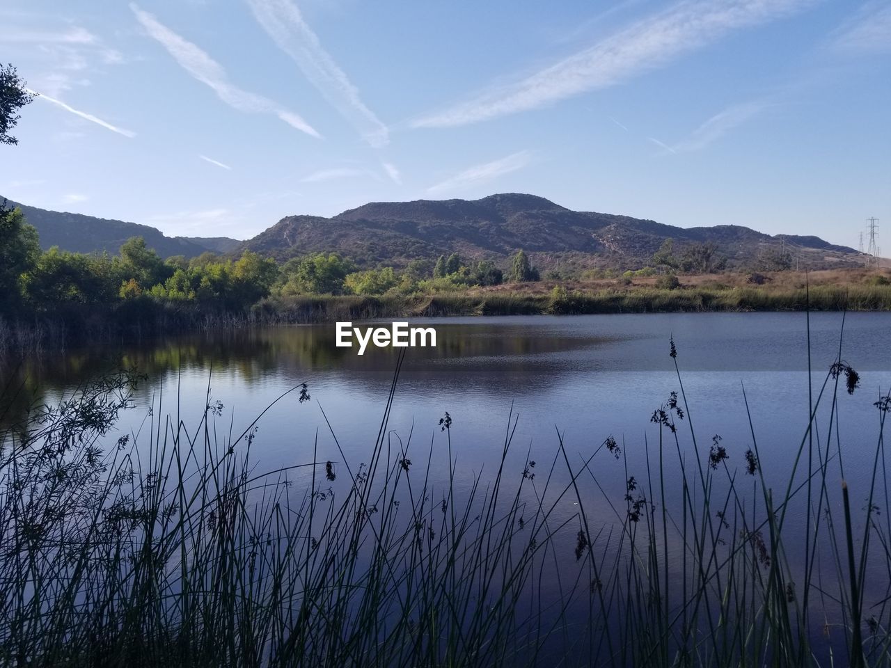 SCENIC VIEW OF LAKE AGAINST MOUNTAINS