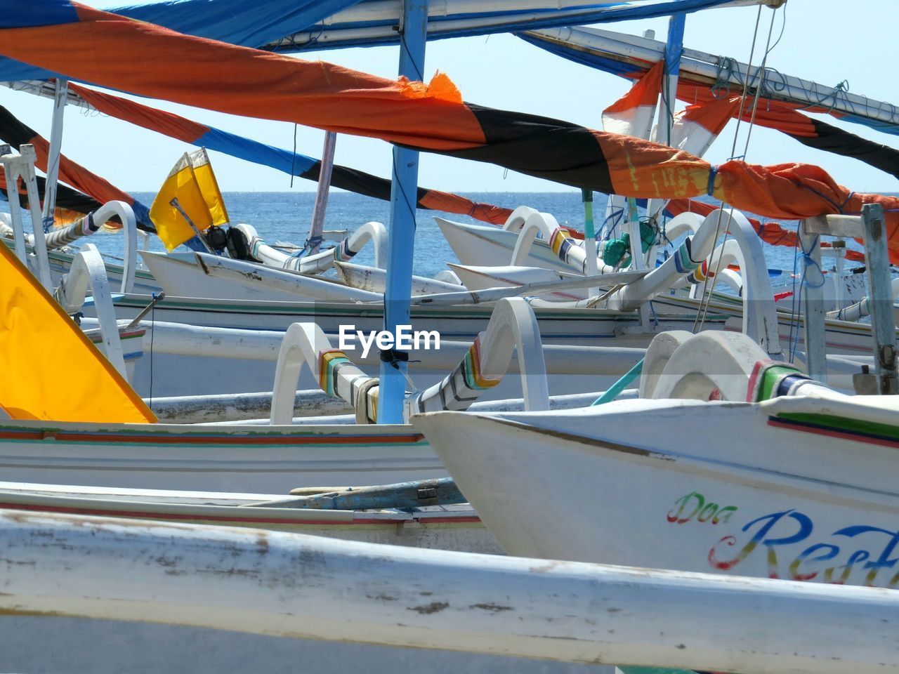 Boats moored at harbor