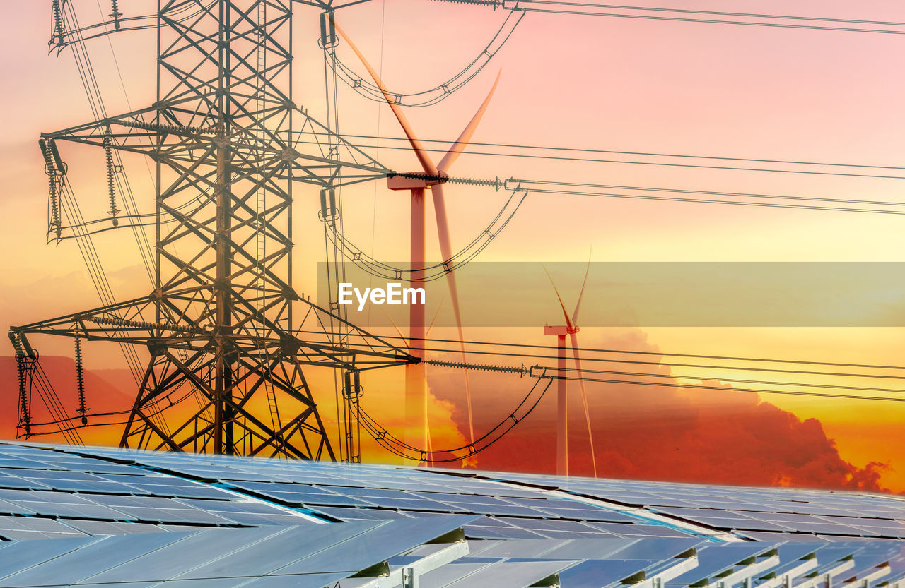 Sustainable energy. solar farm, wind turbine, and electric pylon with sunset sky. sustainable 