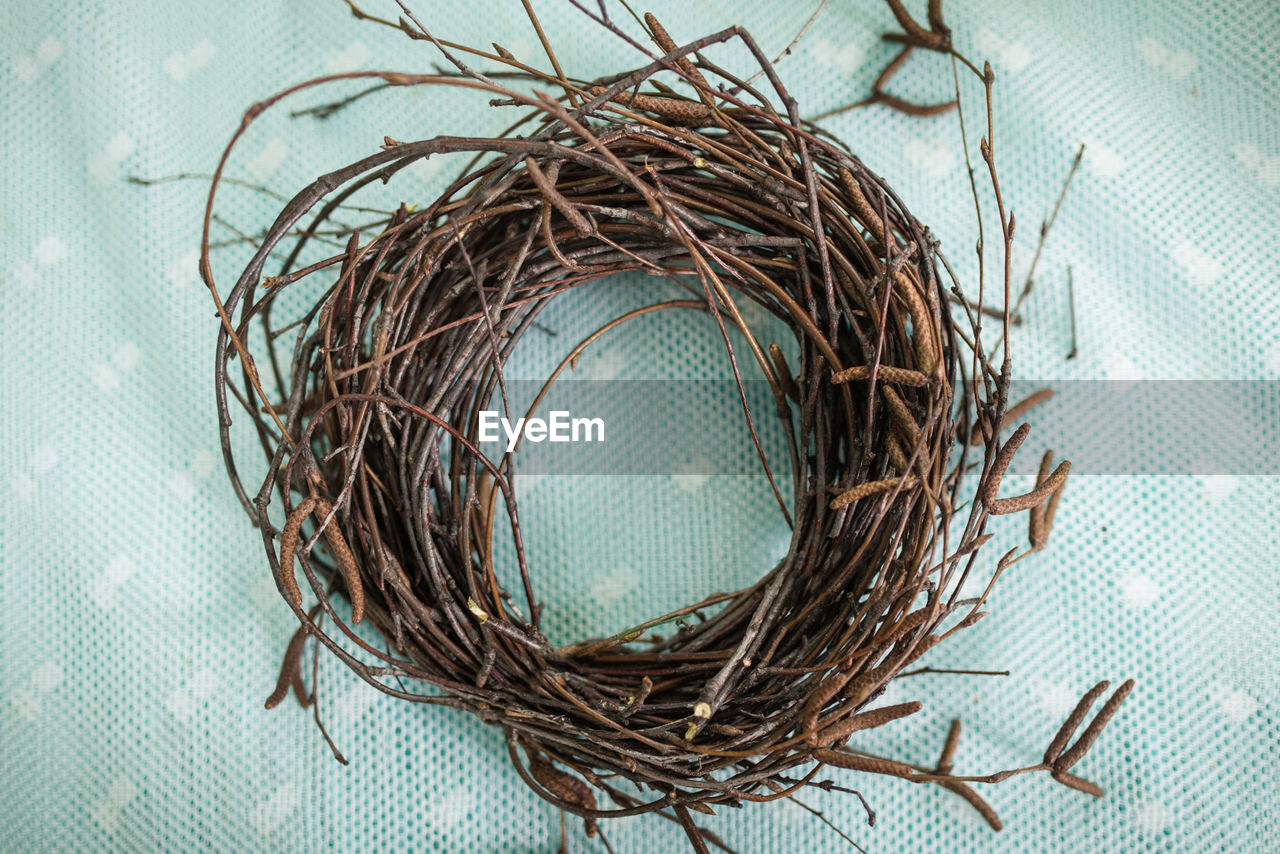 Wreath woven from tree branches. handmade blank for crafts made of wood. children make a wreath of