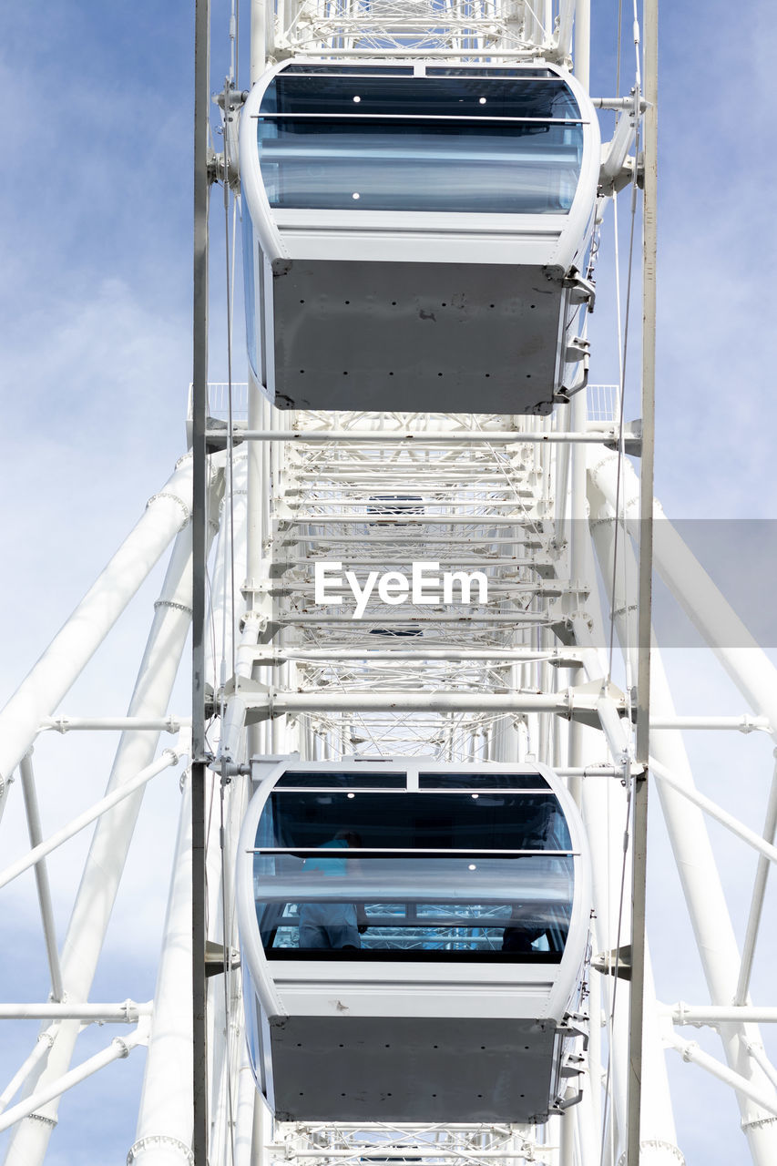 Close-up of telephone booth against sky