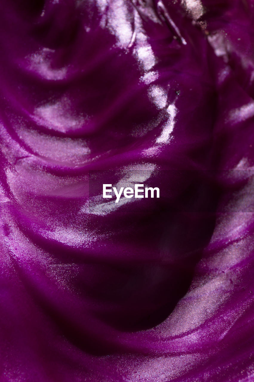 Purple abstract background of organic texture. dynamic smooth shiny wave form texture