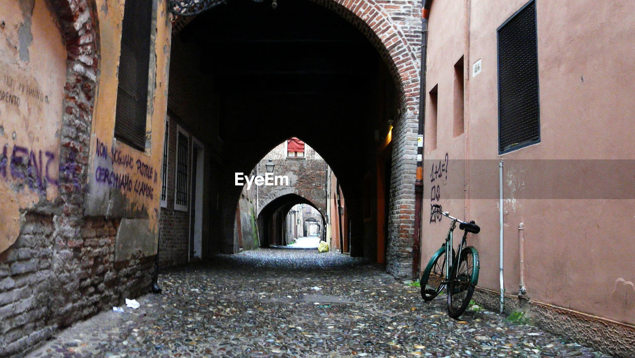 VIEW OF ALLEY AMIDST BUILDINGS