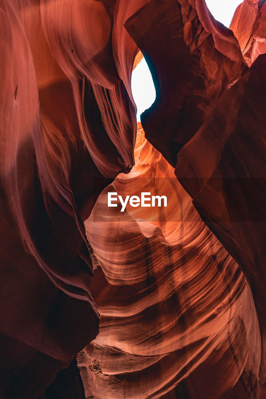 LOW ANGLE VIEW OF ROCK FORMATIONS AT CANYON