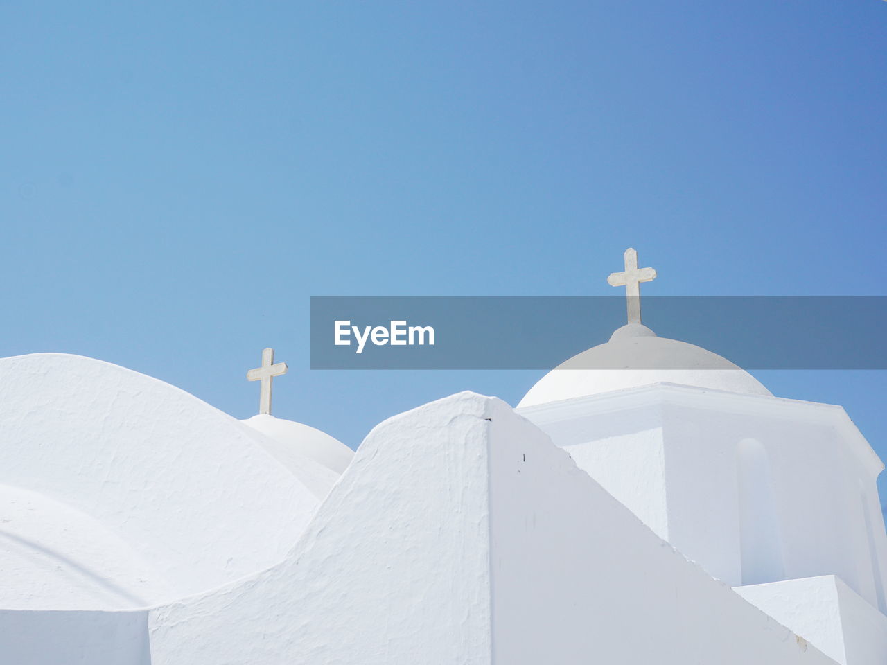 White greek church against clear sky