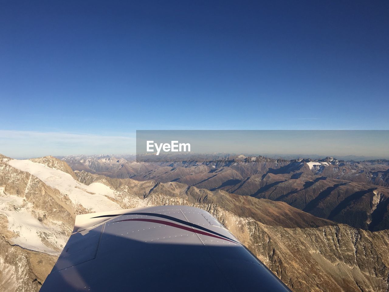 AERIAL VIEW OF LANDSCAPE AGAINST BLUE SKY