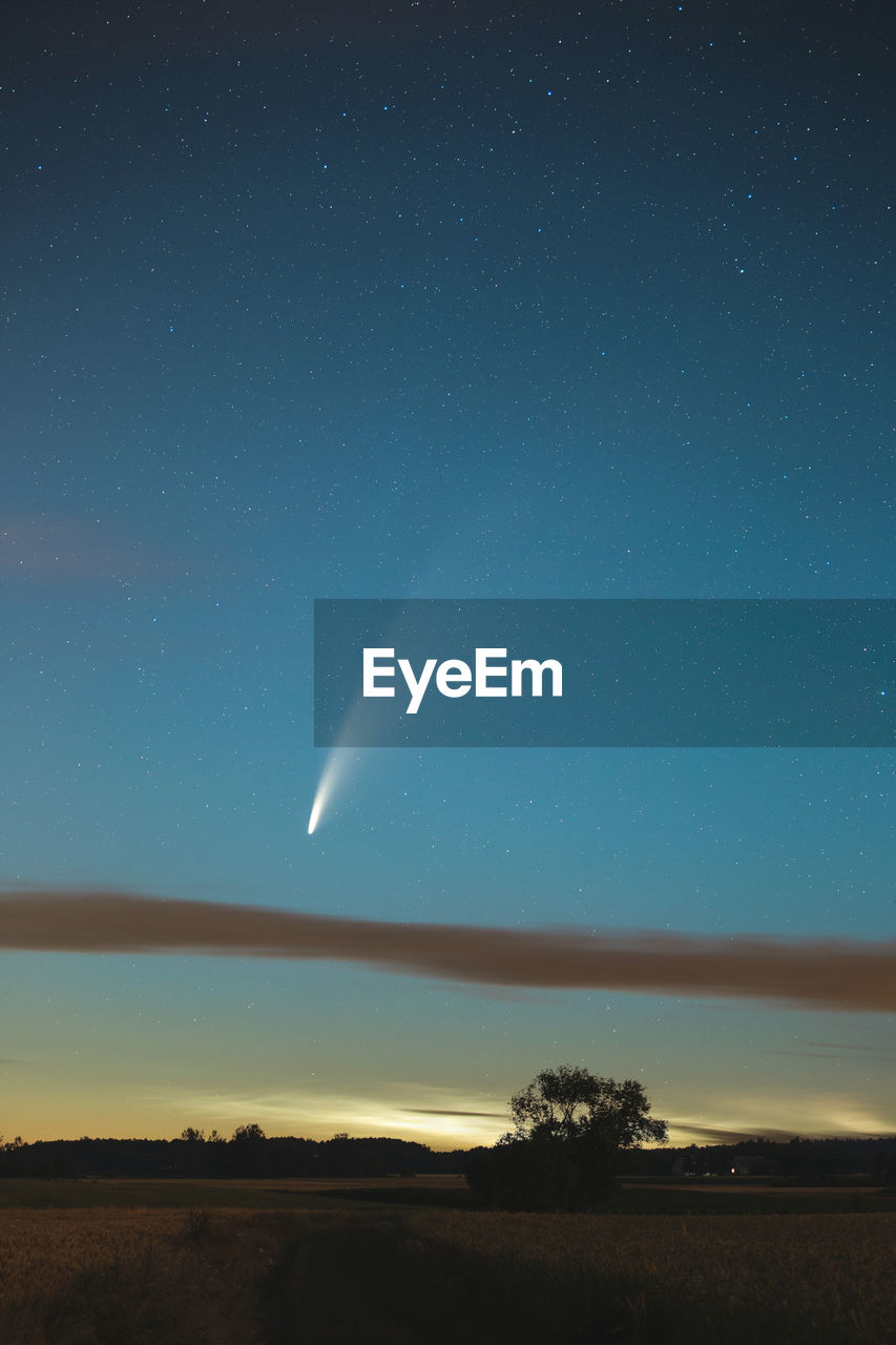 Neowise comet with noctilucent clouds under it.