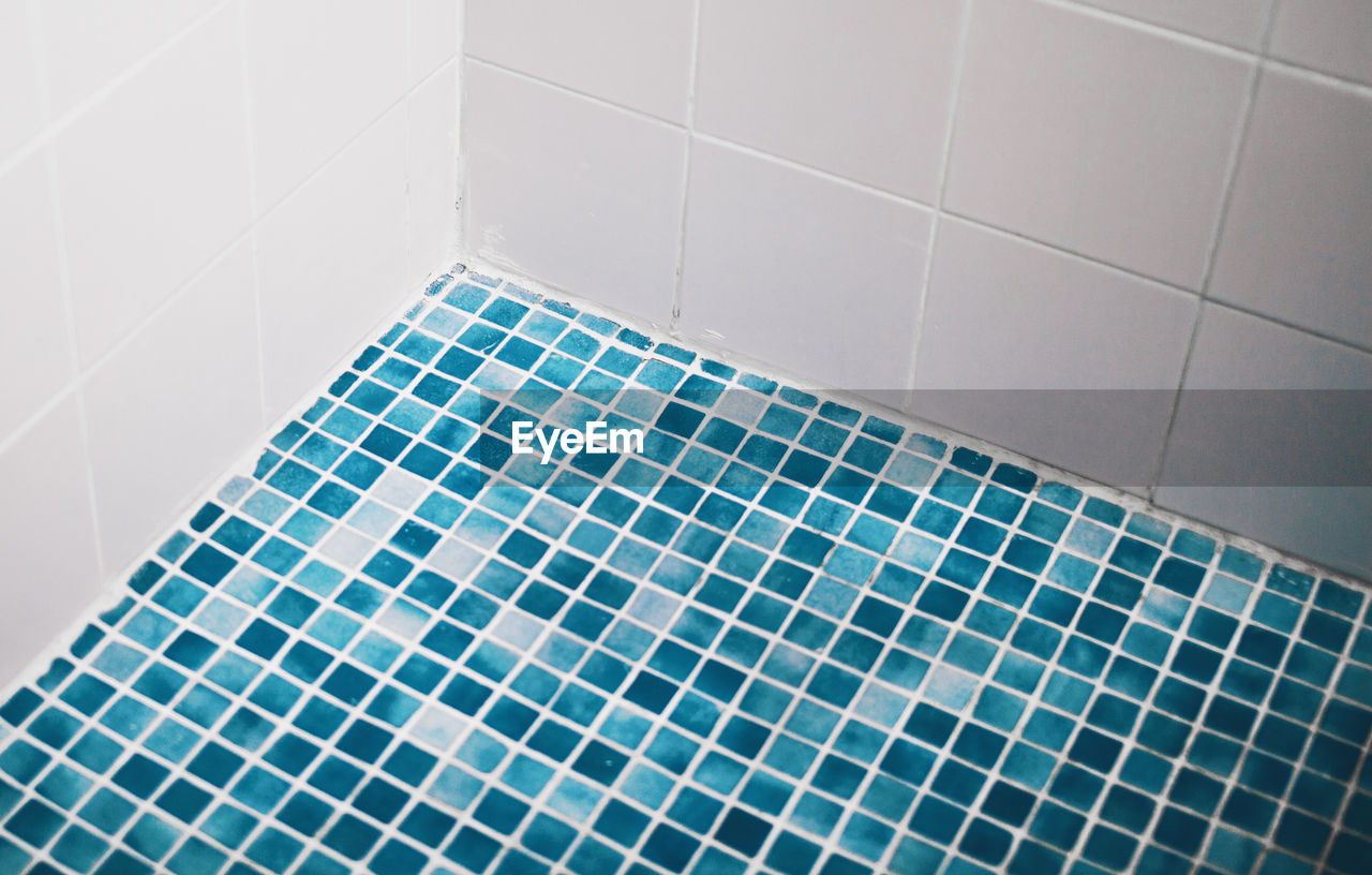 High angle view of tiled floor in bathroom