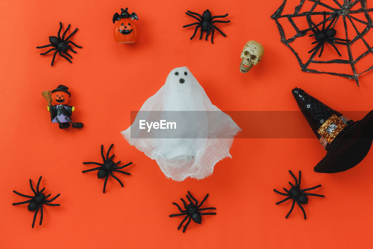 High angle view of halloween decoration on orange background
