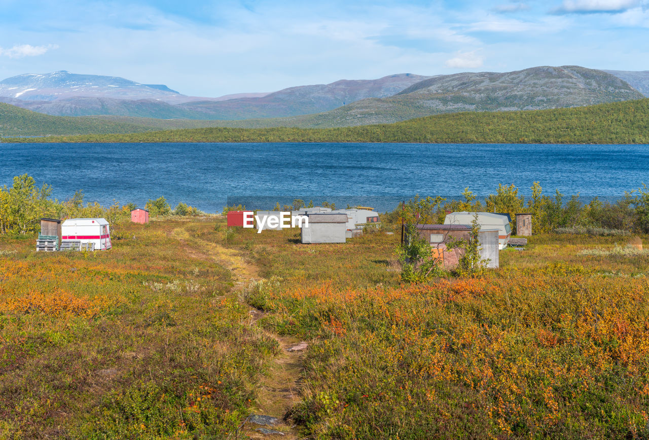 Fishermen's caravans by a lake deep in the swedish lapland. sunny day and fall colors in abisko np