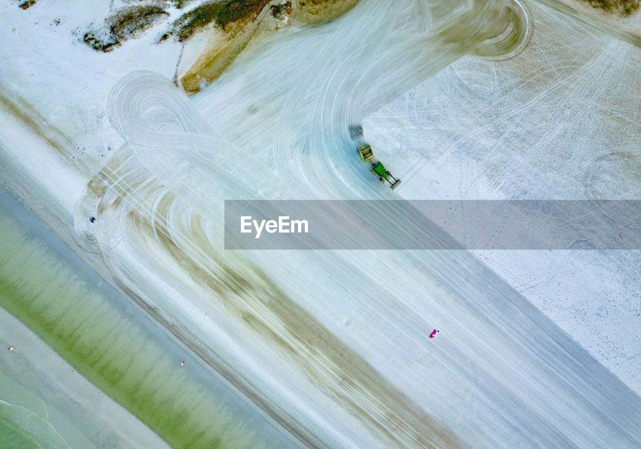 Aerial view of vehicle on frozen lake
