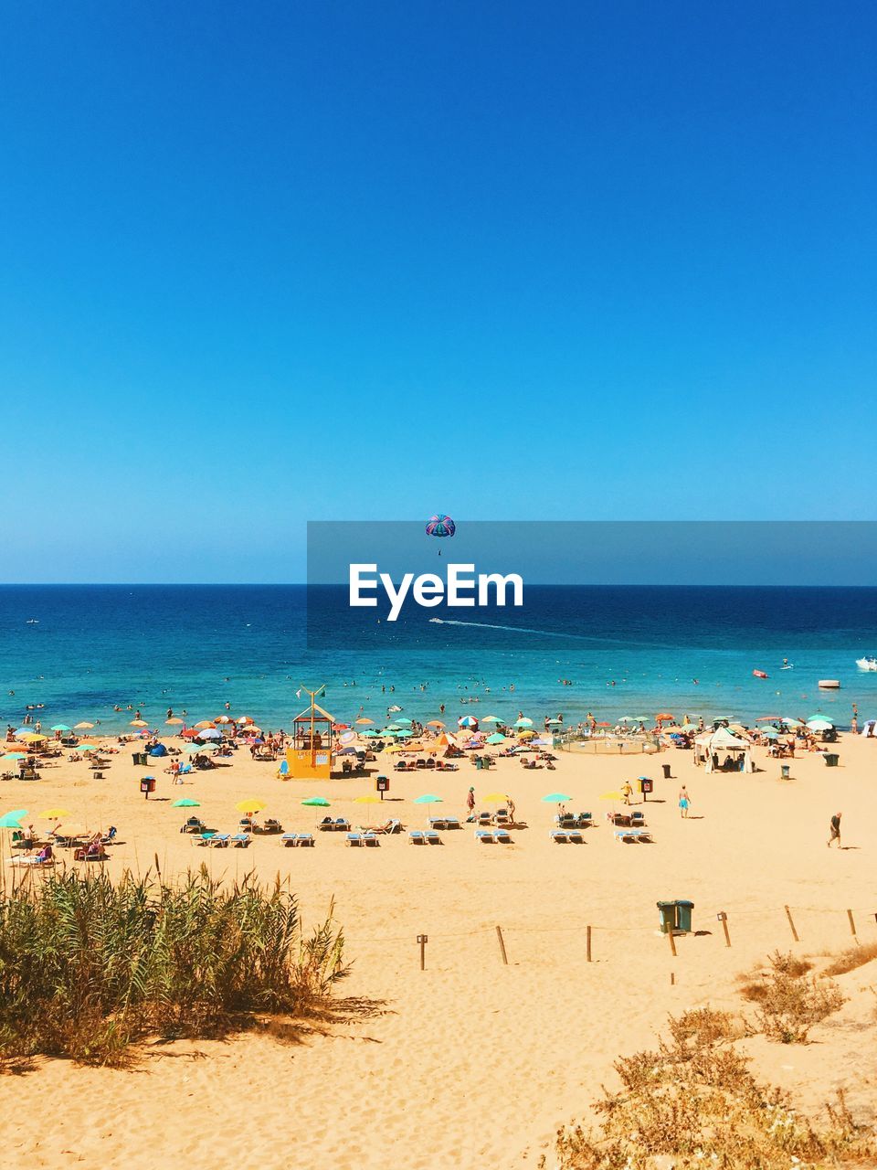 Scenic view of sea against clear blue sky